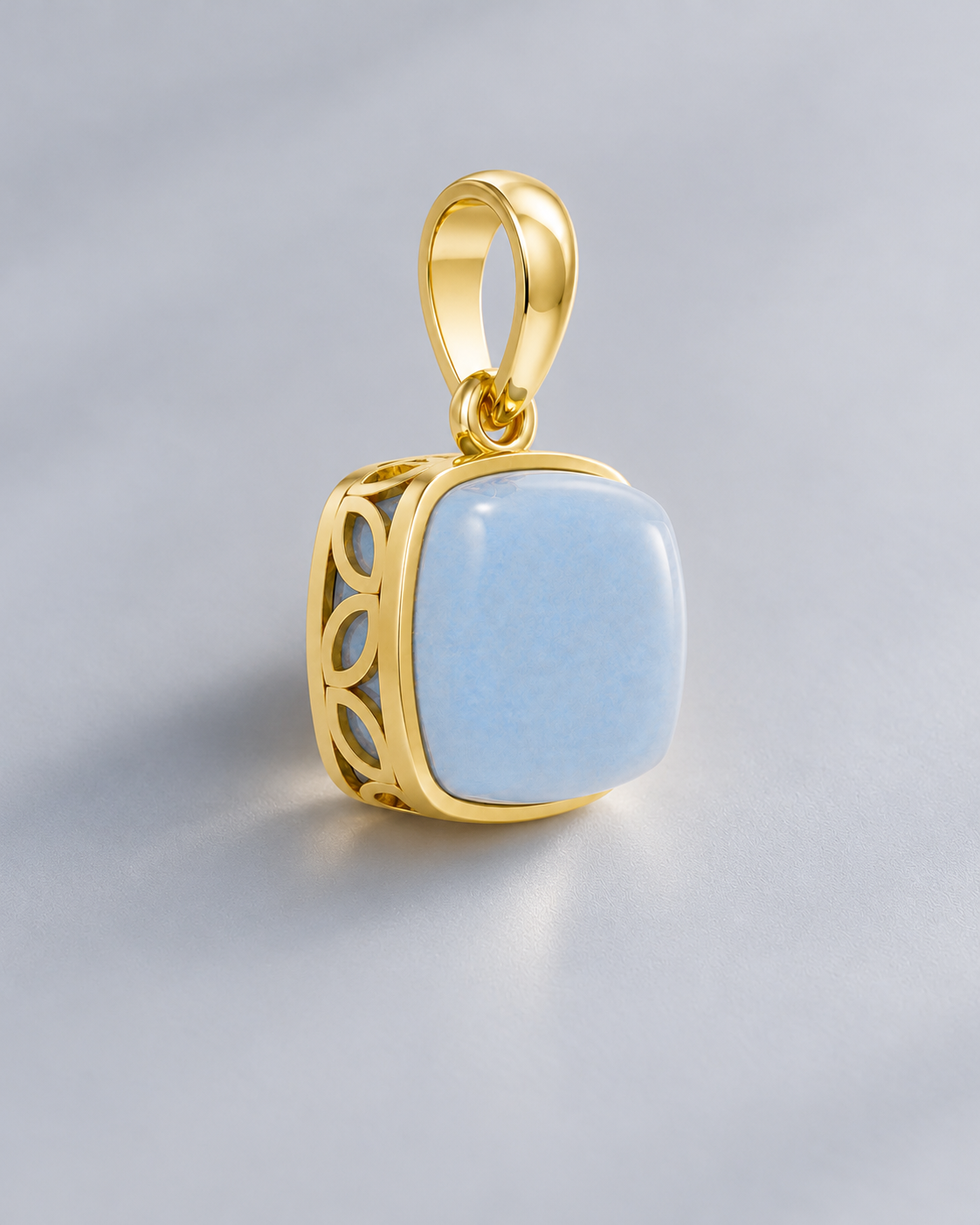 Milky aqua blue cushion stone pendant in a bezel setting